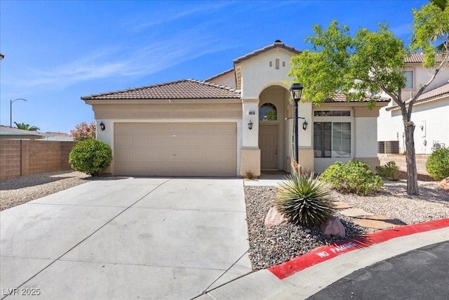 10613 Tiffanieville Ct, Las Vegas, NV 89129 - mediterranean / spanish-style home featuring stucco siding, an attached garage, driveway, and a tiled roof