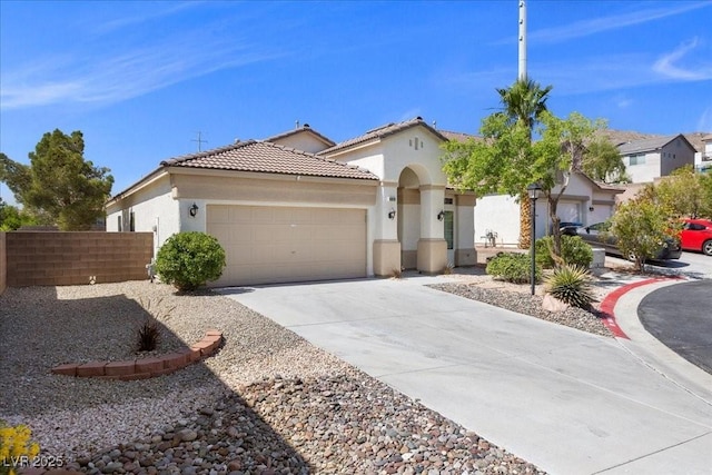 10613 Tiffanieville Ct, Las Vegas, NV 89129 - mediterranean / spanish house with a garage, driveway, stucco siding, and a tile roof