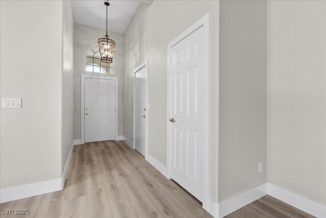 10613 Tiffanieville Ct, Las Vegas, NV 89129 - foyer entrance featuring a chandelier and light wood-type flooring