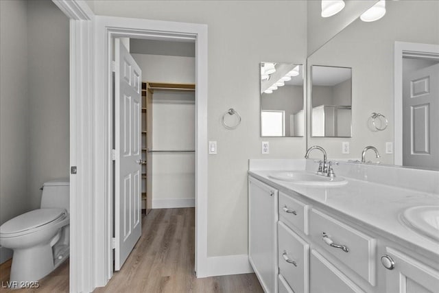 10613 Tiffanieville Ct, Las Vegas, NV 89129 - full bath with double vanity, wood finished floors, and a spacious closet