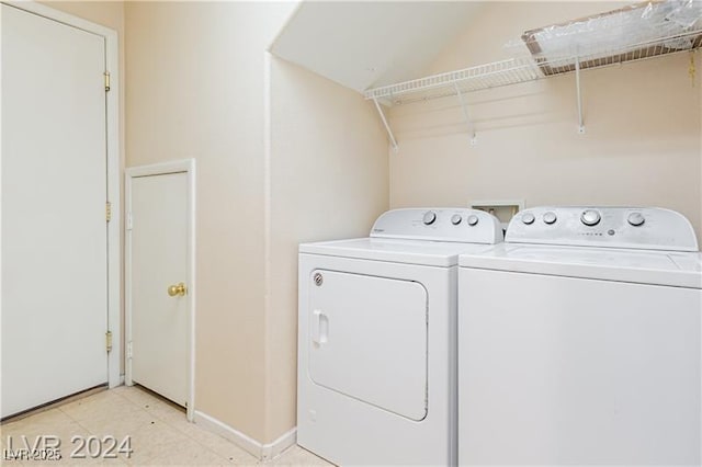 11577 Vesuvio Ct, Las Vegas, NV 89183 - laundry area featuring washer and clothes dryer and baseboards