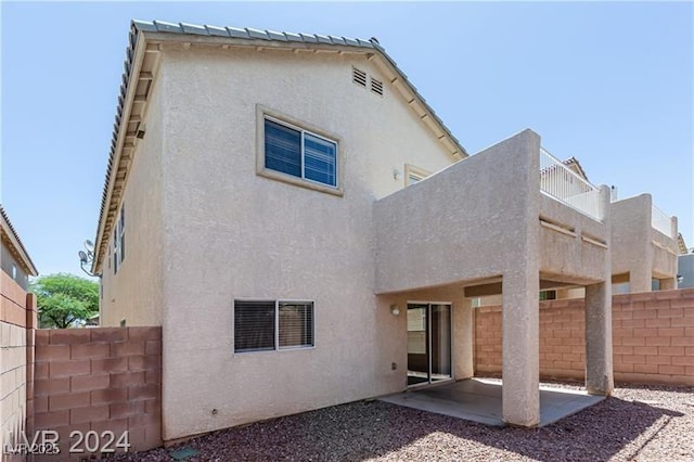 11577 Vesuvio Ct, Las Vegas, NV 89183 - rear view of property featuring a patio area and stucco siding