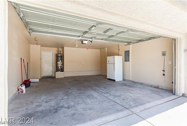 11577 Vesuvio Ct, Las Vegas, NV 89183 - garage with freestanding refrigerator, a garage door opener, secured water heater, and electric panel