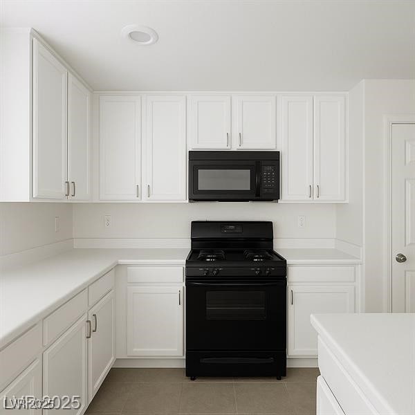 520 Shire Hall St, Las Vegas, NV 89178 - kitchen featuring black appliances, light tile patterned floors, and white cabinets