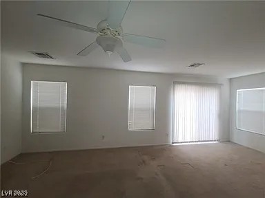 520 Shire Hall St, Las Vegas, NV 89178 - spare room with ceiling fan and carpet
