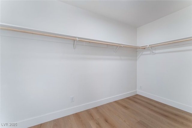 3915 Delling Ct, Las Vegas, NV 89104 - spacious closet featuring wood finished floors