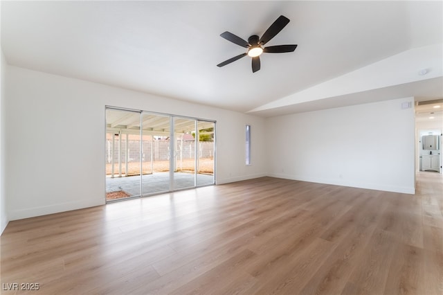 3915 Delling Ct, Las Vegas, NV 89104 - spare room with lofted ceiling, a ceiling fan, and light wood-type flooring