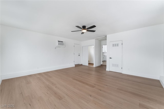 3915 Delling Ct, Las Vegas, NV 89104 - unfurnished room featuring light wood finished floors, a ceiling fan, and a wall mounted air conditioner
