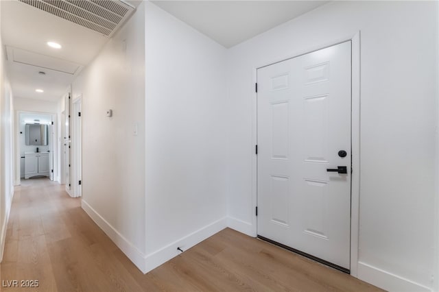 3915 Delling Ct, Las Vegas, NV 89104 - corridor featuring light wood-style flooring, attic access, and recessed lighting