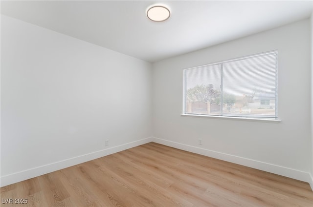 3915 Delling Ct, Las Vegas, NV 89104 - spare room featuring baseboards and light wood-style flooring