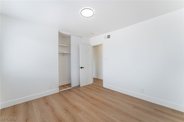 3915 Delling Ct, Las Vegas, NV 89104 - unfurnished bedroom with light wood finished floors and a closet