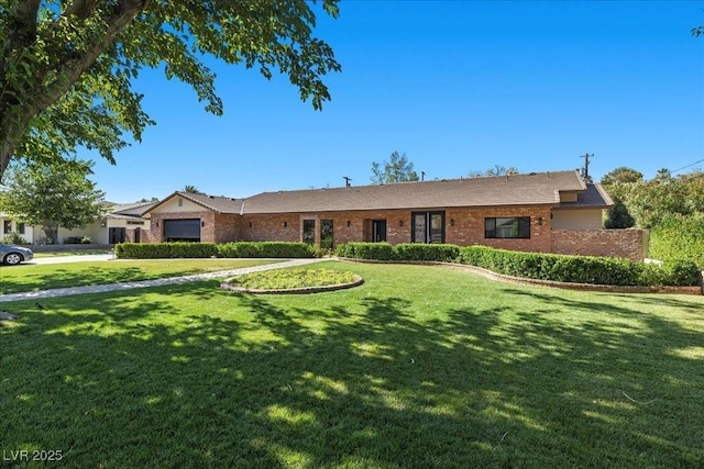 3104 Conners Dr, Las Vegas, NV 89107 - ranch-style home featuring brick siding, a front yard, and an attached garage