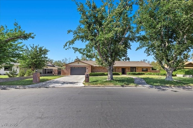 3104 Conners Dr, Las Vegas, NV 89107 - view of front of house featuring driveway, a garage, a front yard, and brick siding
