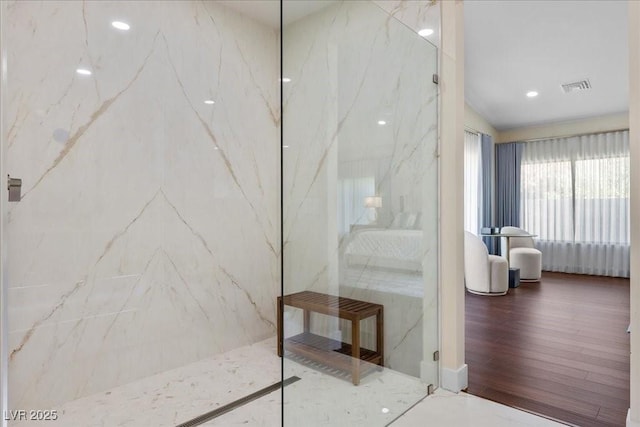 3104 Conners Dr, Las Vegas, NV 89107 - full bath featuring a marble finish shower, wood finished floors, and recessed lighting