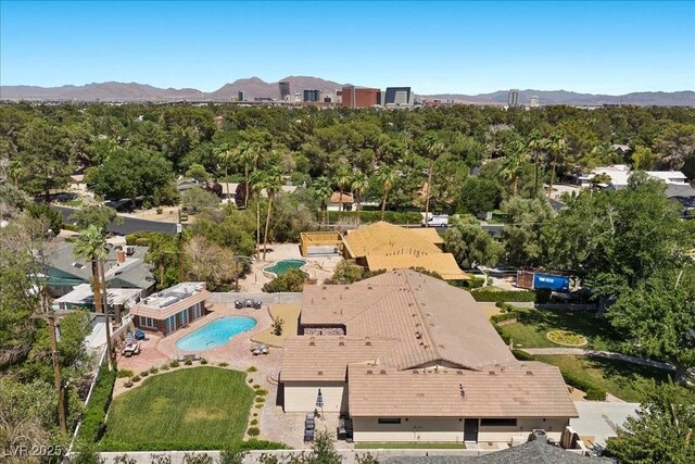 3104 Conners Dr, Las Vegas, NV 89107 - drone / aerial view of a mountainous background and a pool area