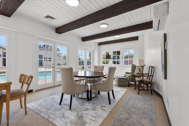 3104 Conners Dr, Las Vegas, NV 89107 - dining room featuring french doors, light carpet, plenty of natural light, and a wood ceiling with exposed beams
