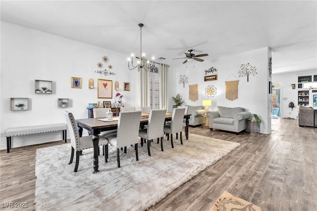 10654 Sidlaw Hills Ct, Las Vegas, NV 89141 - dining area featuring wood finished floors, a chandelier, and a ceiling fan
