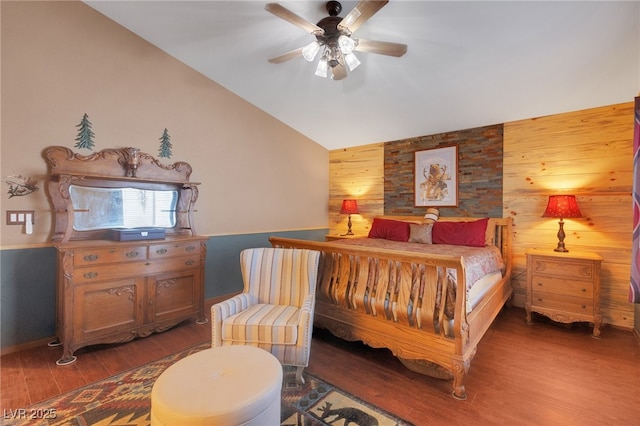 4415 Peaceful Harbor St, Las Vegas, NV 89129 - bedroom with wooden walls, lofted ceiling, wood finished floors, a ceiling fan, and an accent wall