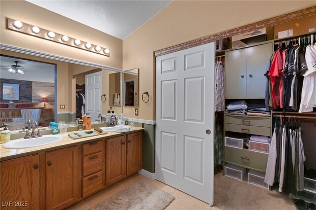 4415 Peaceful Harbor St, Las Vegas, NV 89129 - full bathroom featuring double vanity, ceiling fan, and a walk in closet