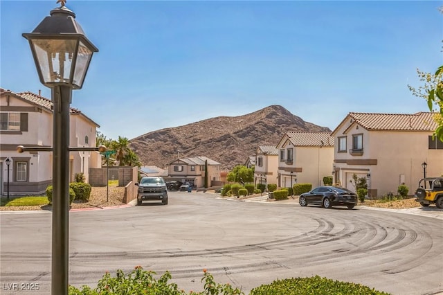 4415 Peaceful Harbor St, Las Vegas, NV 89129 - view of asphalt road featuring a residential view and a mountain view
