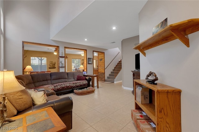 4415 Peaceful Harbor St, Las Vegas, NV 89129 - living room with light tile patterned floors, stairway, and recessed lighting