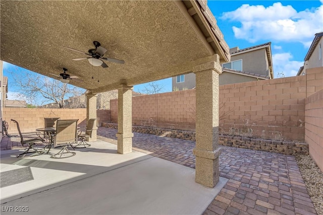 7707 W Diablo Dr, Las Vegas, NV 89113 - fenced backyard featuring ceiling fan, a patio, and outdoor dining area