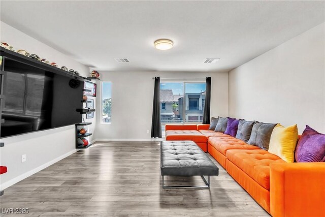 5976 Rockway Glen Ave, Las Vegas, NV 89141 - living area with healthy amount of natural light and wood finished floors