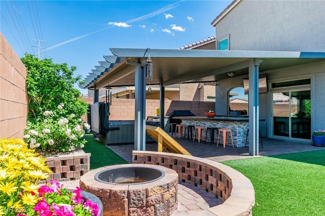 5976 Rockway Glen Ave, Las Vegas, NV 89141 - view of patio / terrace featuring an outdoor fire pit and a hot tub