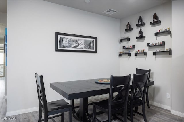 5976 Rockway Glen Ave, Las Vegas, NV 89141 - dining space featuring wood finished floors and a bar