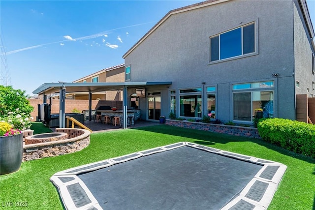 5976 Rockway Glen Ave, Las Vegas, NV 89141 - back of property with stucco siding and a patio