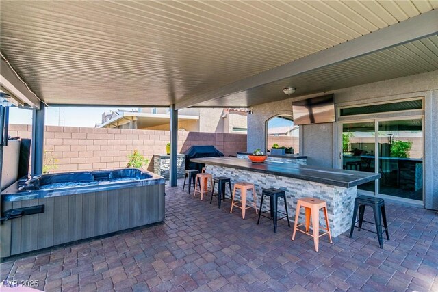 5976 Rockway Glen Ave, Las Vegas, NV 89141 - fenced backyard featuring a hot tub, a patio area, and grilling area