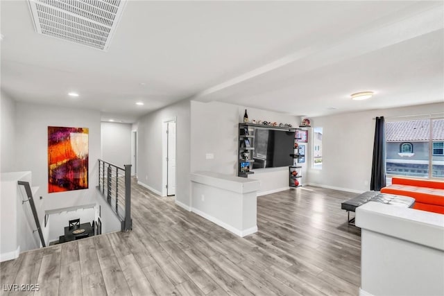 5976 Rockway Glen Ave, Las Vegas, NV 89141 - unfurnished living room featuring wood finished floors and recessed lighting