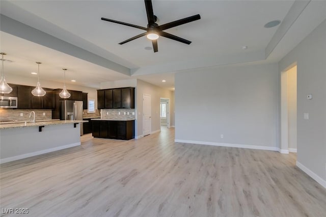 6085 Ryan Ranch Ave, Las Vegas, NV 89130 - unfurnished living room with a ceiling fan, recessed lighting, and light wood finished floors