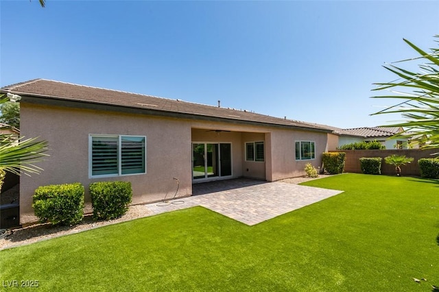 6085 Ryan Ranch Ave, Las Vegas, NV 89130 - back of property featuring stucco siding, a patio, and ceiling fan