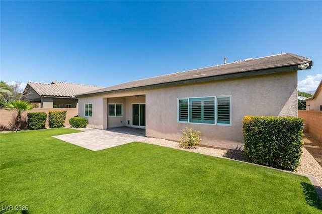 6085 Ryan Ranch Ave, Las Vegas, NV 89130 - rear view of house featuring a fenced backyard, stucco siding, and a patio area