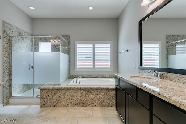 6085 Ryan Ranch Ave, Las Vegas, NV 89130 - full bathroom featuring plenty of natural light, a garden tub, vanity, a shower stall, and recessed lighting