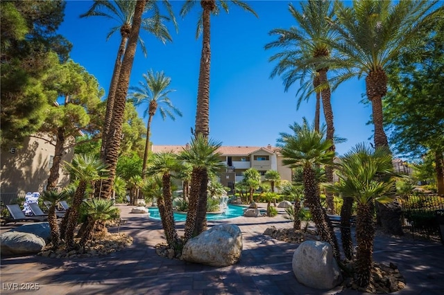 4200 S Valley View Blvd Unit 1077, Las Vegas, NV 89103 - view of front of house featuring an outdoor pool and stucco siding