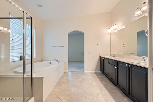 9252 Oxbow Lake Ave, Las Vegas, NV 89149 - bathroom featuring a bath, double vanity, a stall shower, and tile patterned floors