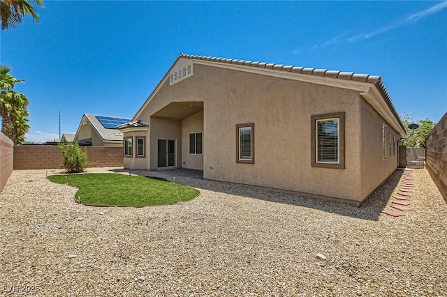 9252 Oxbow Lake Ave, Las Vegas, NV 89149 - rear view of house with stucco siding, a fenced backyard, and a tiled roof