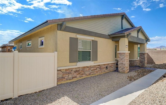 794 Sunny Sagebrush St, Henderson, NV 89011 - view of property exterior featuring stone siding and stucco siding