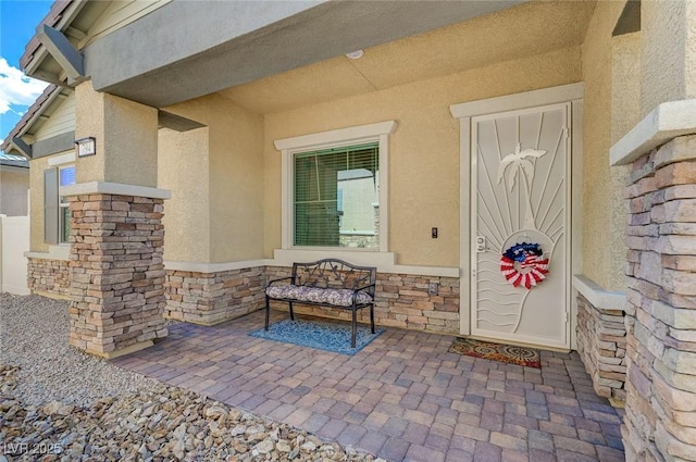 794 Sunny Sagebrush St, Henderson, NV 89011 - doorway to property with stone siding and stucco siding
