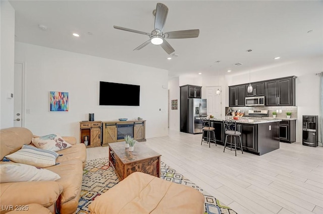 794 Sunny Sagebrush St, Henderson, NV 89011 - living room featuring ceiling fan, light wood-style flooring, and recessed lighting