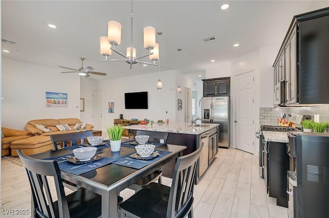 794 Sunny Sagebrush St, Henderson, NV 89011 - dining room featuring a ceiling fan, a chandelier, and recessed lighting