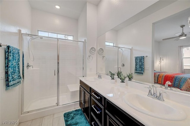 794 Sunny Sagebrush St, Henderson, NV 89011 - ensuite bathroom featuring double vanity, a stall shower, tile patterned floors, and a ceiling fan