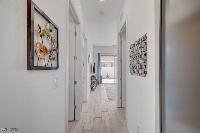 794 Sunny Sagebrush St, Henderson, NV 89011 - hallway featuring light wood-style flooring and baseboards