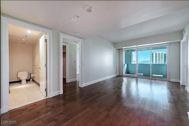 2700 Las Vegas Blvd Unit 1804, Las Vegas, NV 89109 - empty room with dark wood-type flooring and baseboards