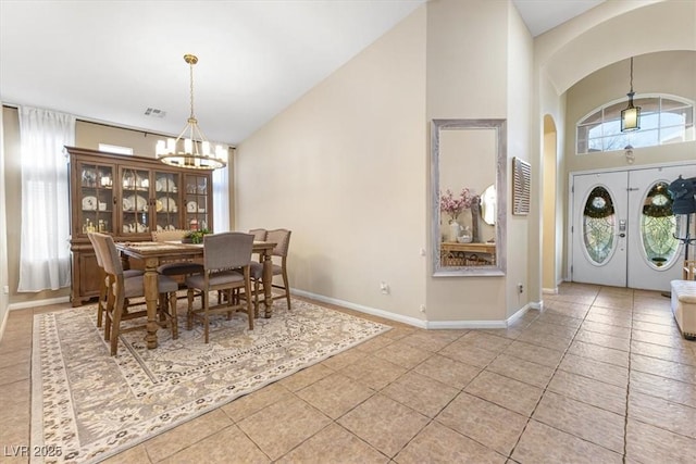 10638 La Spezia Way, Las Vegas, NV 89141 - tiled dining room with a chandelier and high vaulted ceiling