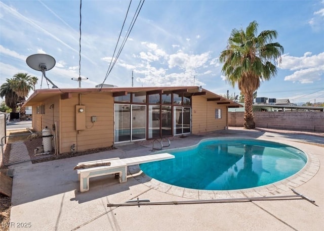 6112 Fairwood Cir, Las Vegas, NV 89107 - view of pool featuring a patio area, a fenced backyard, and a diving board