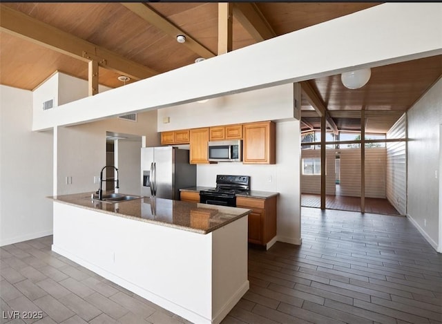 6112 Fairwood Cir, Las Vegas, NV 89107 - kitchen featuring appliances with stainless steel finishes, a wood ceiling with exposed beams, dark stone counters, and high vaulted ceiling