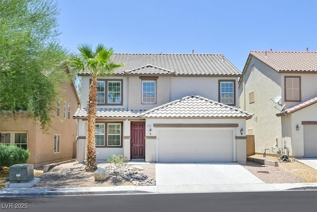 6133 Roseboro Ct, North Las Vegas, NV 89081 - view of front of property featuring an attached garage, driveway, a tile roof, and stucco siding